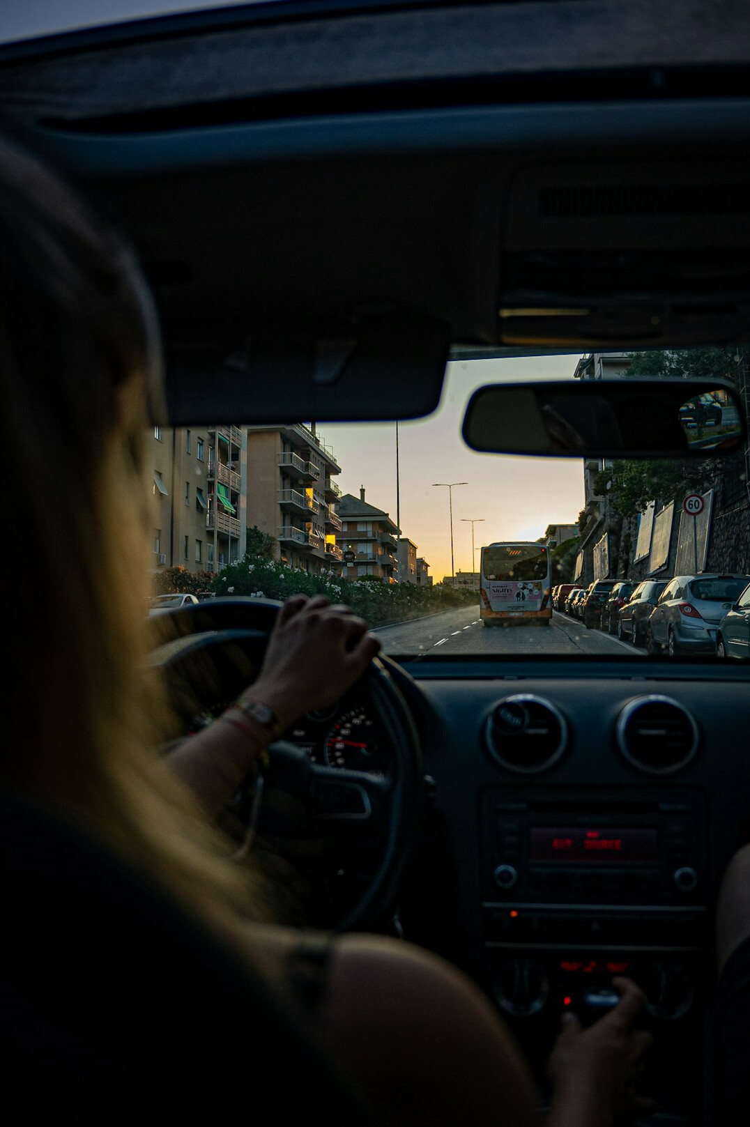 person waiting in car at dusk