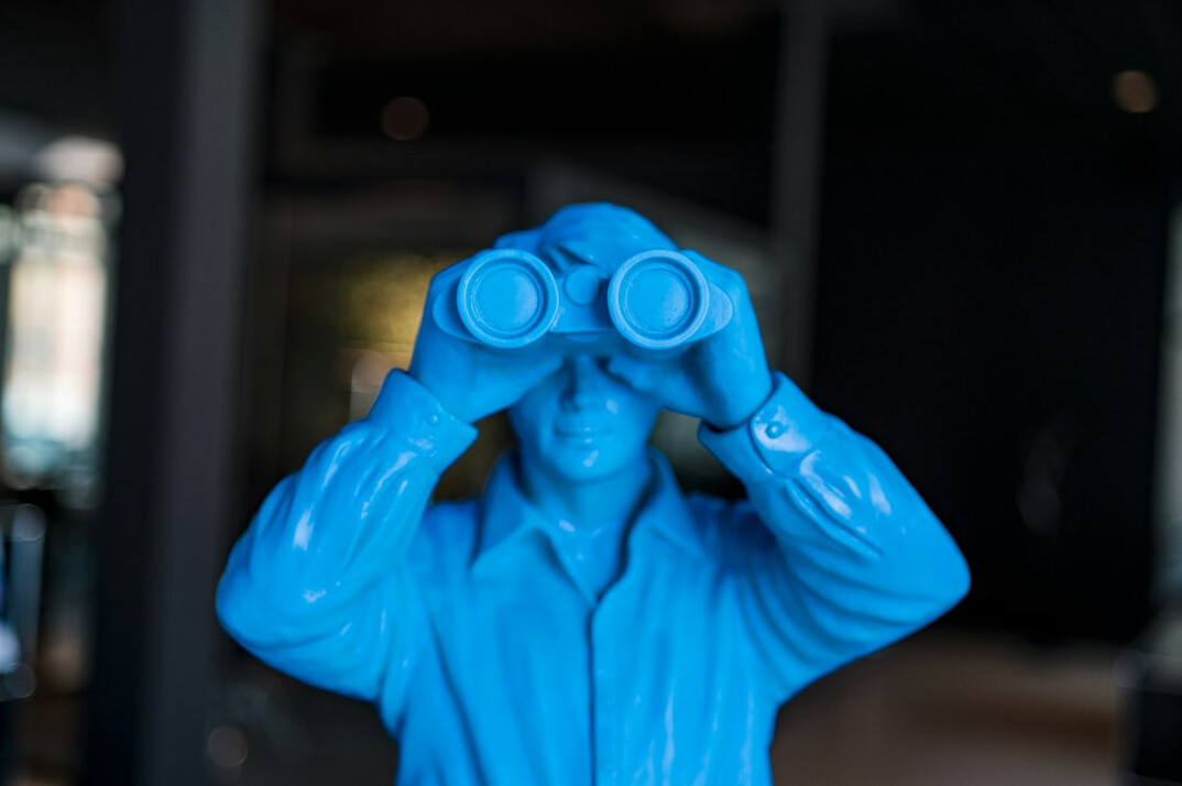 detective using binoculars